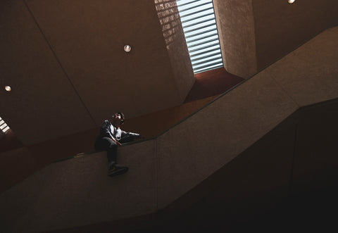 a person sitting on a staircase