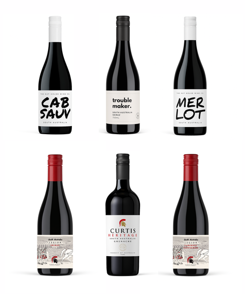 Six bottles of wine with various labels on a white background
